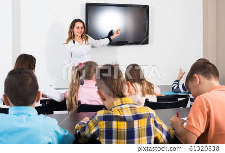 children with teacher in classroom children with teacher in classroom 61320838