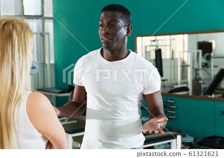 Man and woman talking at gym Man and woman talking at gym 61321621