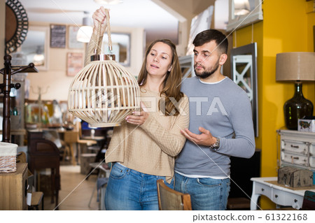 Girl with boyfriend in search of lampshade 61322168