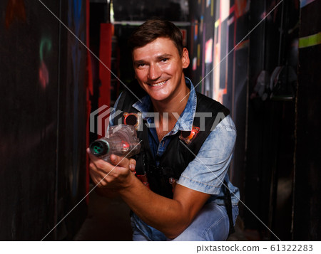 guy took aim colored laser guns during laser tag game guy took aim colored laser guns during laser tag game 61322283
