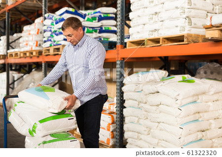 Man choosing materials for home renovation Man choosing materials for home renovation 61322320