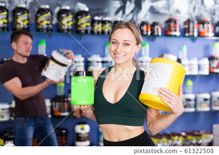 bodybuilder girl with sport food supplements bodybuilder girl with sport food supplements 61322508
