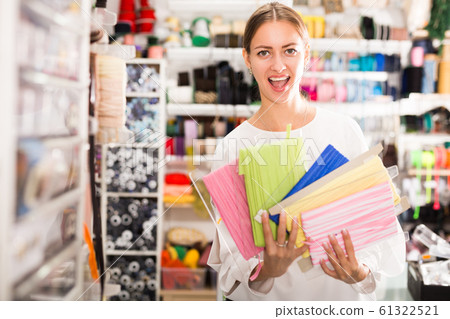 Delighted woman with ribbons 61322521