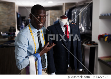 Portrait of afro-american man customer choosing business style tie in the shop 61322528