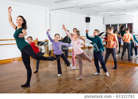Children dancing contemp in studio smiling and having fun Children dancing contemp in studio smiling and having fun 61322781