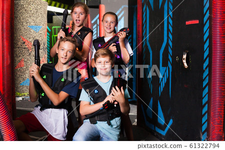 Happy teenagers with laser guns 61322794
