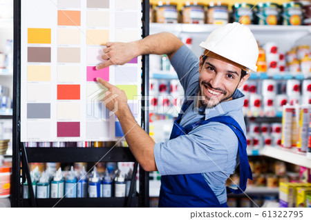 Smiling foreman showing samples of paint 61322795
