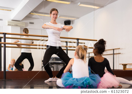 Teacher demonstrating choreographic element Teacher demonstrating choreographic element 61323072