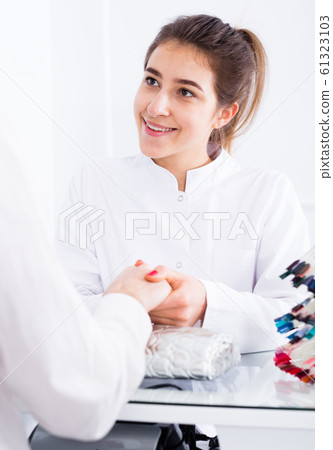 Woman doing manicure 61323103