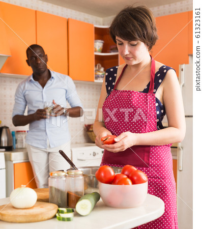 Afro man and European woman cooking 61323161