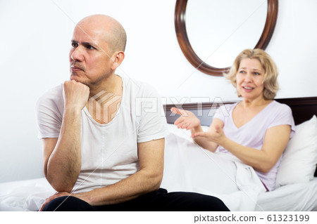 Mature couple quarrels in bed 61323199