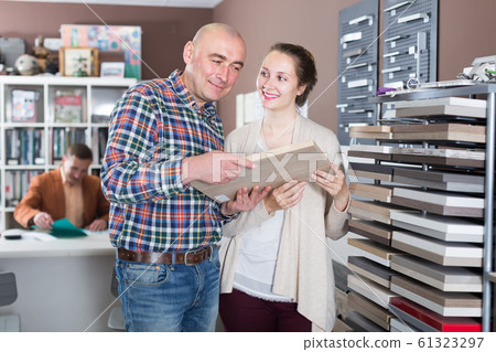 Spouses select a kitchen countertop 61323297