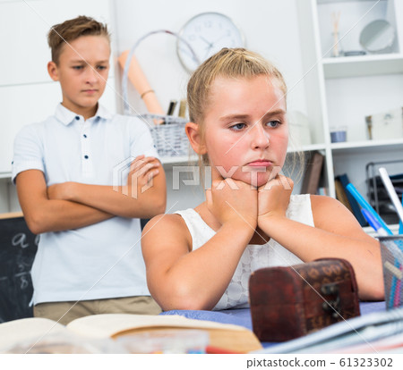 Portrait of girl who is offended by her brother Portrait of girl who is offended by her brother 61323302