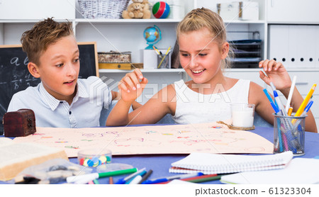 Boy with sister are playing in game Boy with sister are playing in game 61323304