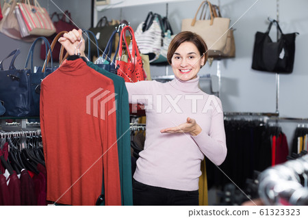 Adult woman enjoying her purchases Adult woman enjoying her purchases 61323323