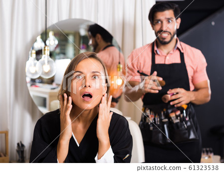 professional makeup artist with female shocked professional makeup artist with female shocked 61323538