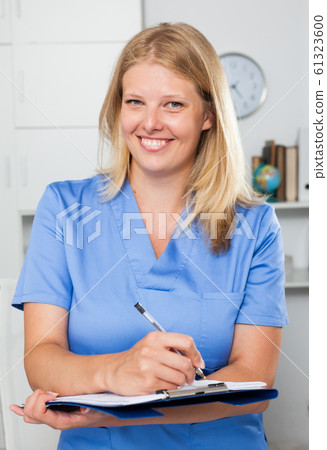 Positive woman doctor in formal wear 61323600