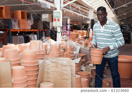African American choosing pots for plants African American choosing pots for plants 61323660
