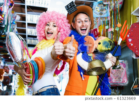 Couple giving thumbs as sign of successful preparation for fest 61323669