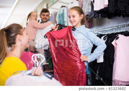 Daughter with adult mother choosing gala dress Daughter with adult mother choosing gala dress 61323682