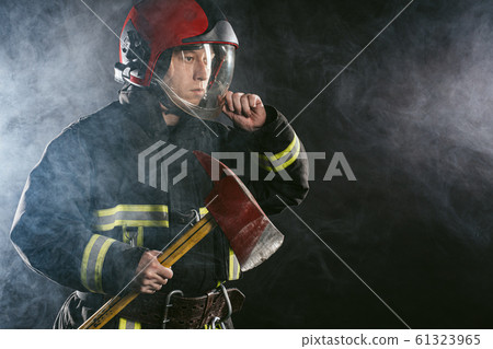 handsome strong fireman with hammer handsome strong fireman with hammer 61323965