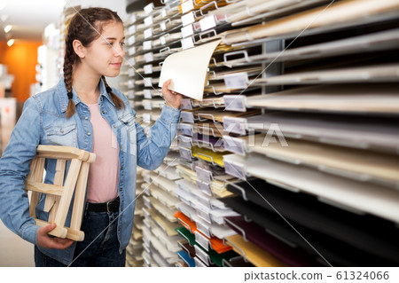 Smiling girl shopping multicolored paper Smiling girl shopping multicolored paper 61324066