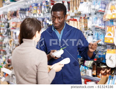 Household store seller working with client Household store seller working with client 61324186