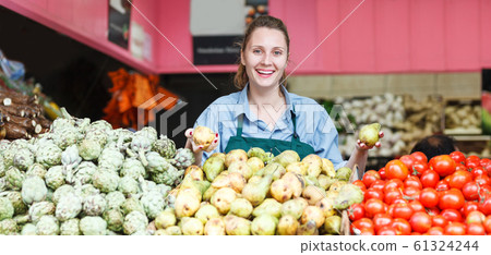 seller who is standing on her workplace seller who is standing on her workplace 61324244