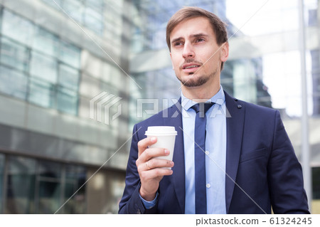 Portrait of cheerful male standing outdoor Portrait of cheerful male standing outdoor 61324245