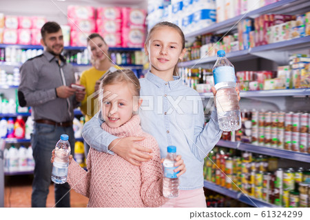 Two sisters holding bottled water 61324299
