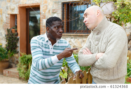 Conflict between neighbors in the country cottage Conflict between neighbors in the country cottage 61324368