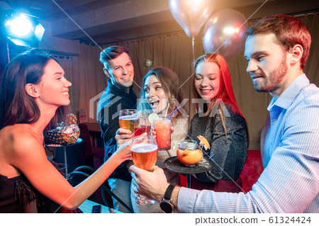 happy laughing people in karaoke club 61324424