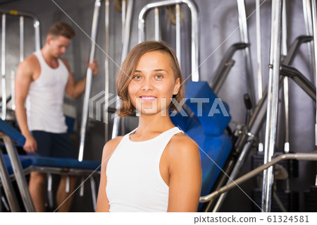 Woman taking pause between exercising Woman taking pause between exercising 61324581