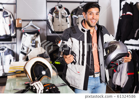 Man choosing moto gloves Man choosing moto gloves 61324586