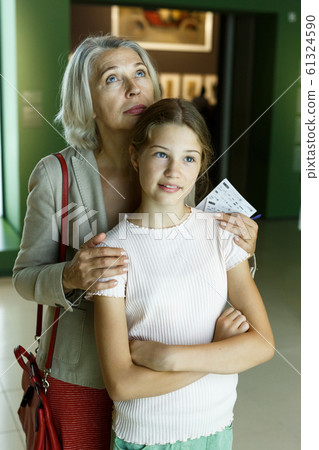 Woman and girl visiting museum Woman and girl visiting museum 61324590