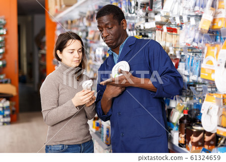 Household store seller working with client 61324659