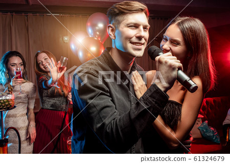 beautiful couple have free time in karaoke club beautiful couple have free time in karaoke club 61324679
