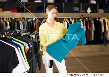 Portrait of female customer buying fashion dress Portrait of female customer buying fashion dress 61324682