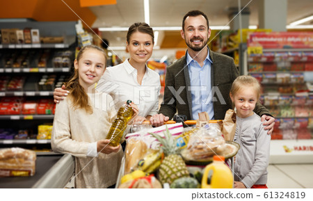 Portrait of happy family children who are standing in shop Portrait of happy family children who are standing in shop 61324819