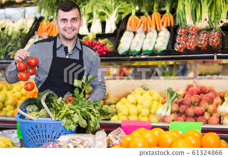 Male seller helping to choose 61324866