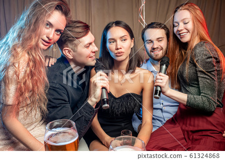 young caucasian clubbers in karaoke bar young caucasian clubbers in karaoke bar 61324868