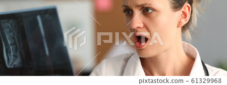 Horrified female doctor Horrified female doctor 61329968