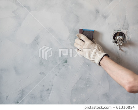 Worker scrubbing the wall Worker scrubbing the wall 61330854