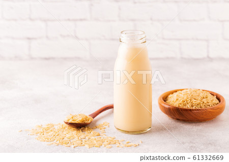 A bottle of rice milk and rice. 61332669