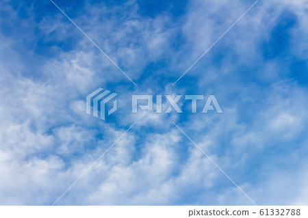 clouds form a mosaic against the blue sky. clouds form a mosaic against the blue sky. 61332788