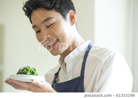 Man cooking Man cooking 61333199