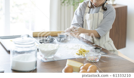 Girl baking cookies Girl baking cookies 61333210
