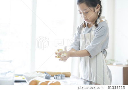 Girl baking cookies Girl baking cookies 61333215