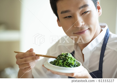 Man cooking Man cooking 61333227