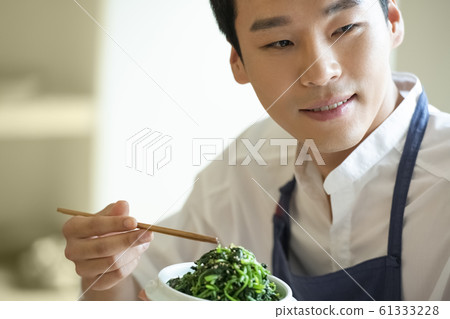Man cooking Man cooking 61333228